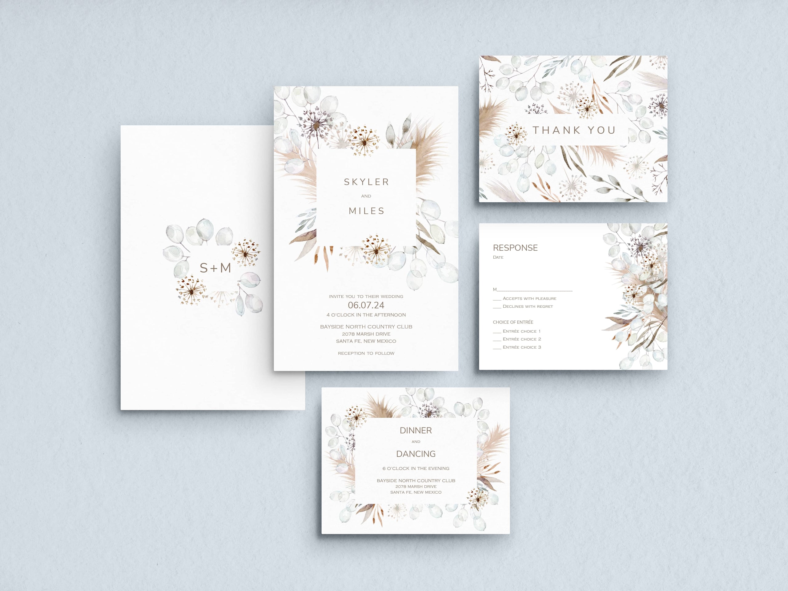 Boho wedding logo on a wedding invitation suite