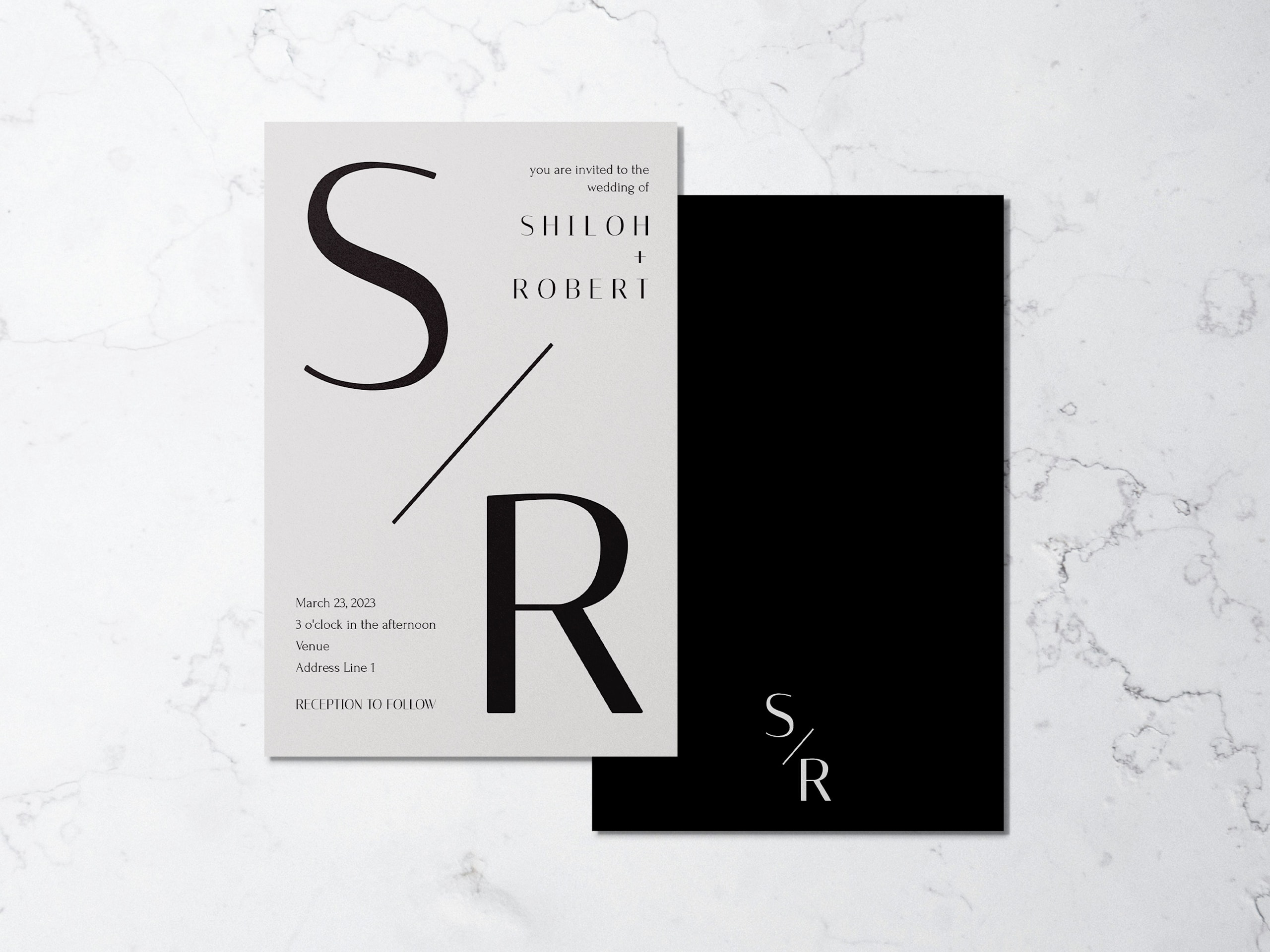 Minimalist wedding monogram logo on a wedding invitation