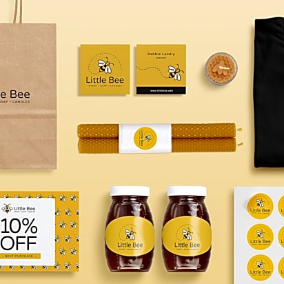 Branded product materials for Little Bee, including paper bag, brochures, jars, candles, t-shirt, stickers, and business cards – a visual example of how to market a product.