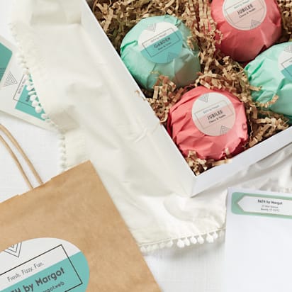 pastel stickers and labels on small business' paper product packaging