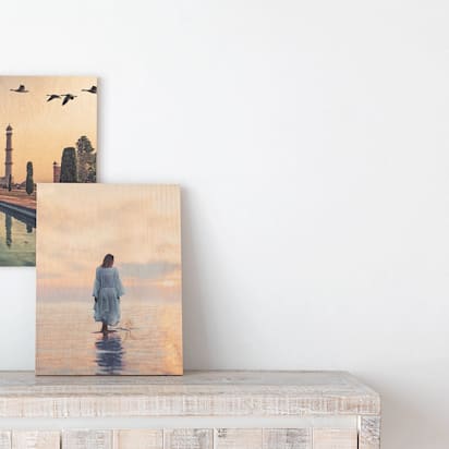 geographical prints adorning fireplace