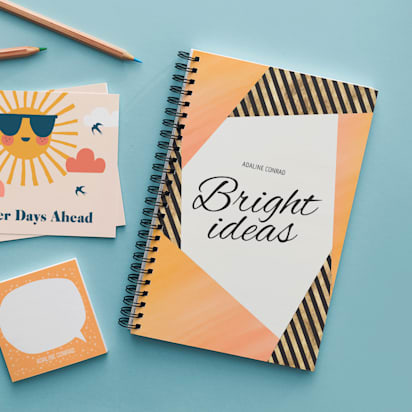 note book with bright ideas written on the front