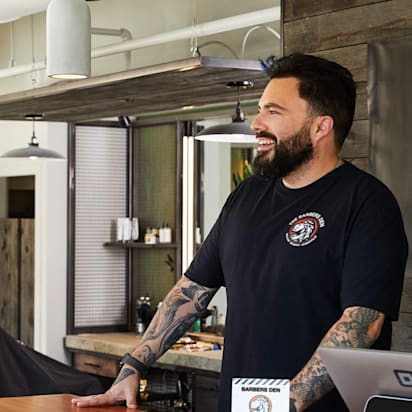 marketing collateral example of customer being greeted at branded store front