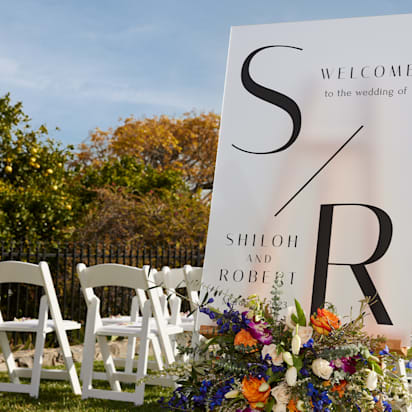 A wedding welcome sign with a monogram design