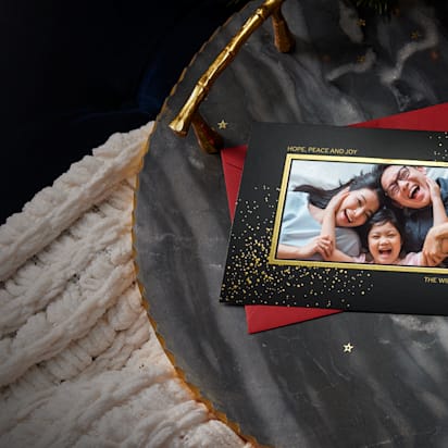 open cardboard gift box with paper neatly folded and sealed with a sticker