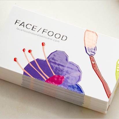 Floral embossed business card for brand called "FACE/FOOD