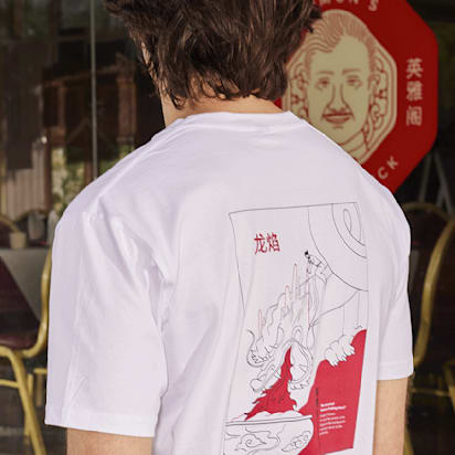 back-facing monochrome t shirt print in red and white, with matching signs in background
