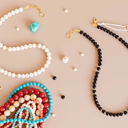 Jewelry making flatlay with semi-precious stone beads and tools. Handmade jewelry, small business, hobby concept