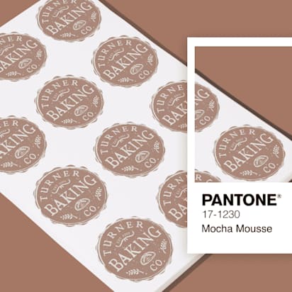 Pantone color of the year 'Mocha Mousse' background with branded stickers featuring stylized logos and text.