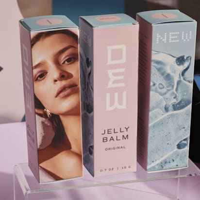 pastel-colored box packaging with female model's face pictured