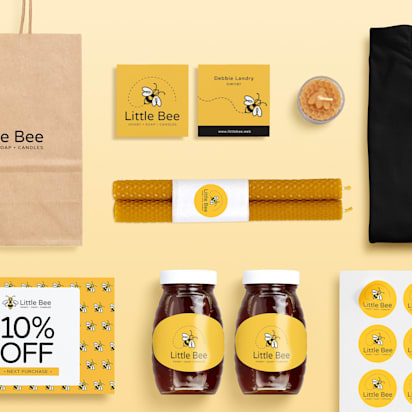 Branded product materials for Little Bee, including paper bag, brochures, jars, candles, t-shirt, stickers, and business cards – a visual example of how to market a product.