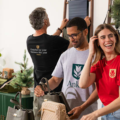 Custom branded apparel and printed shirts displayed in studio showing tshirt design ideas for small business merchandising