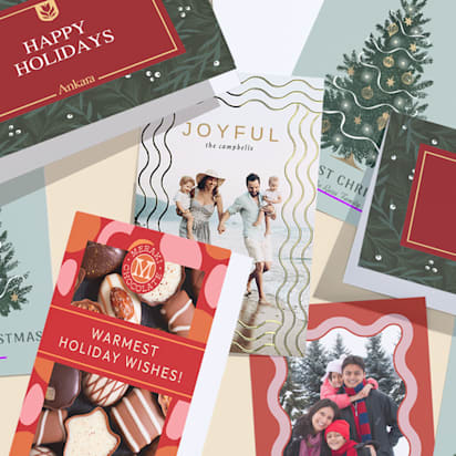 Selection of holiday cards with similar colors of muted reds and greens but different designs and styles