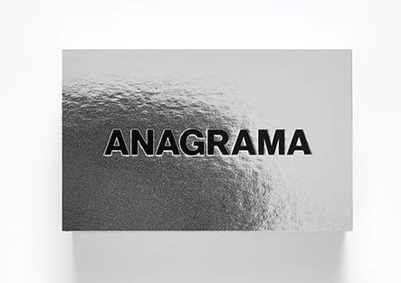 Silver metallic business card with embossed text