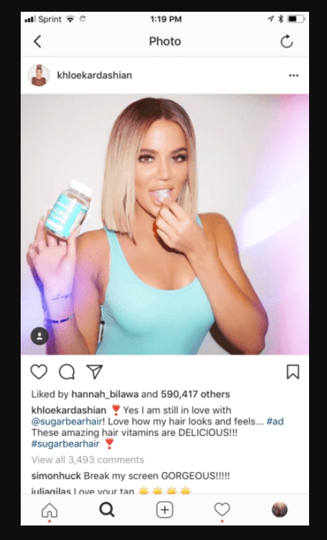 Instagram post showing Khloe Kardashian with a hair product