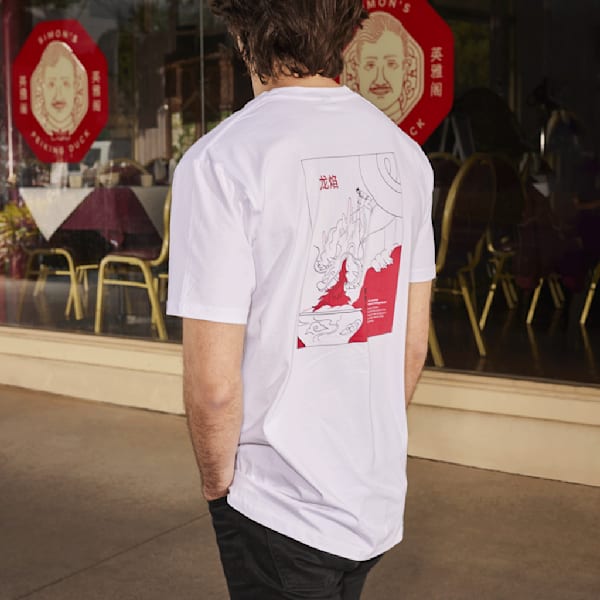 a white T-shirt with a black and red print on the back