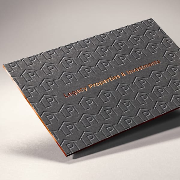 Embossed house pattern on the back of the business card design