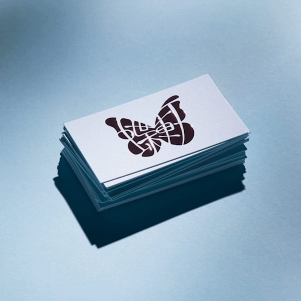 A business card with a butterfly logo, branding design examples