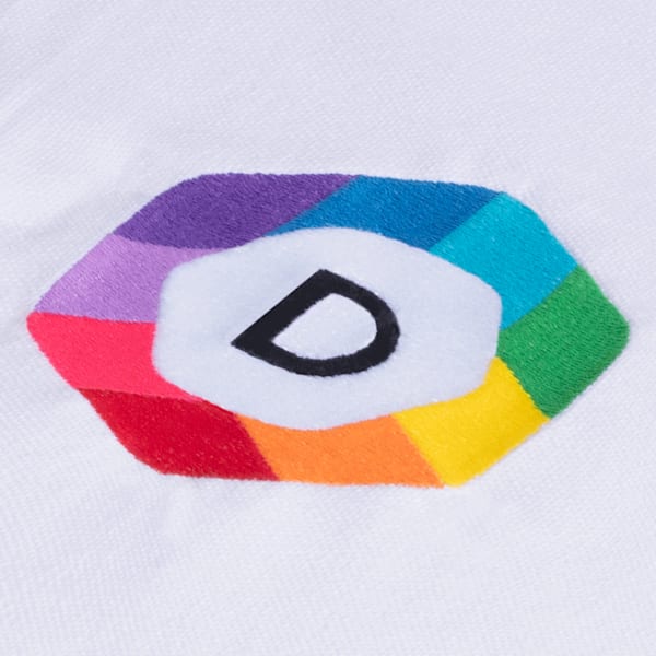 A close-up of a multicolored logo printed on white fabric via embroidery