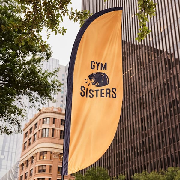 gym combination logo on street pop out sign in front of buildings