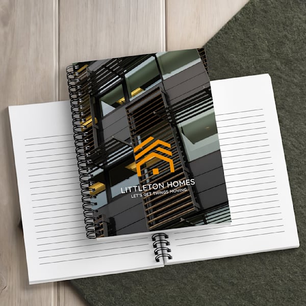 Branded spiral bound notebook featuring the brand logo and tagline &ldquo;Let&rsquo;s get things moving.