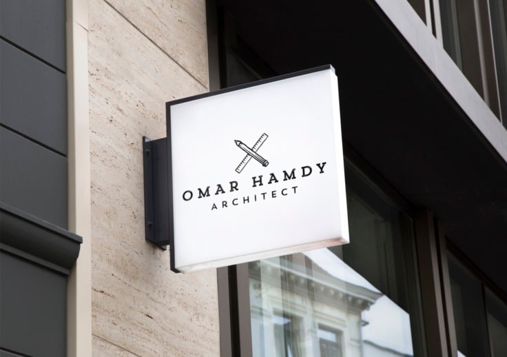 Vintage-style badge logo showing a pencil and ruler