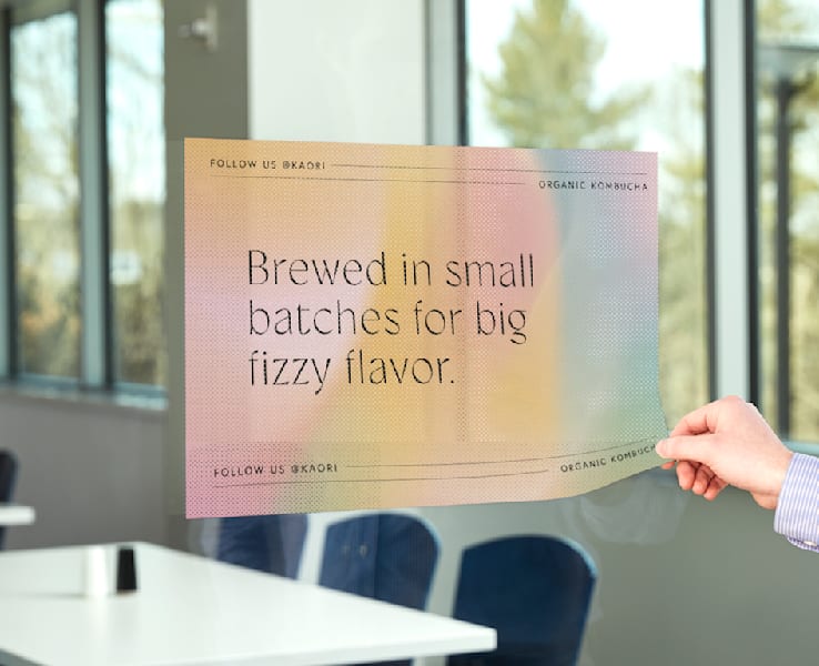 A window decal promoting a kombucha brand