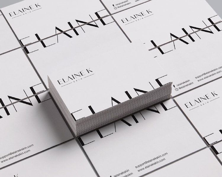 White business card with black text off the edge on front and back