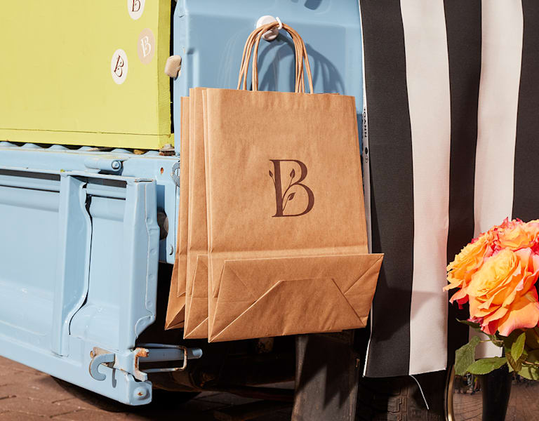 Brand logo printed on a kraft paper bag