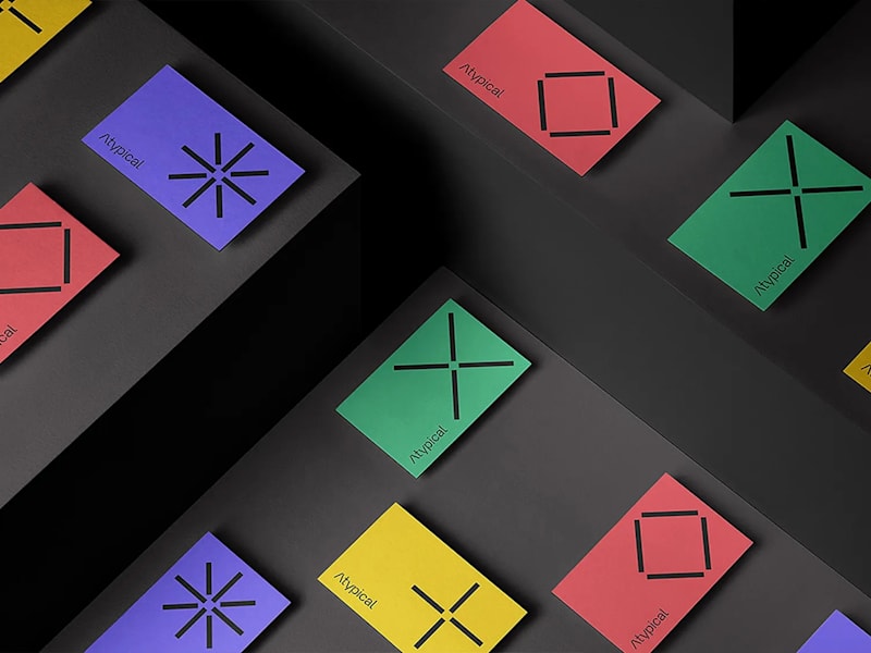 Business card design mockups in four colorways