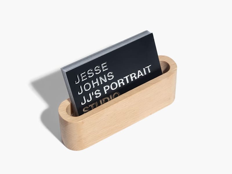 Minimalist business card design with raised foil accents for a portrait photography studio