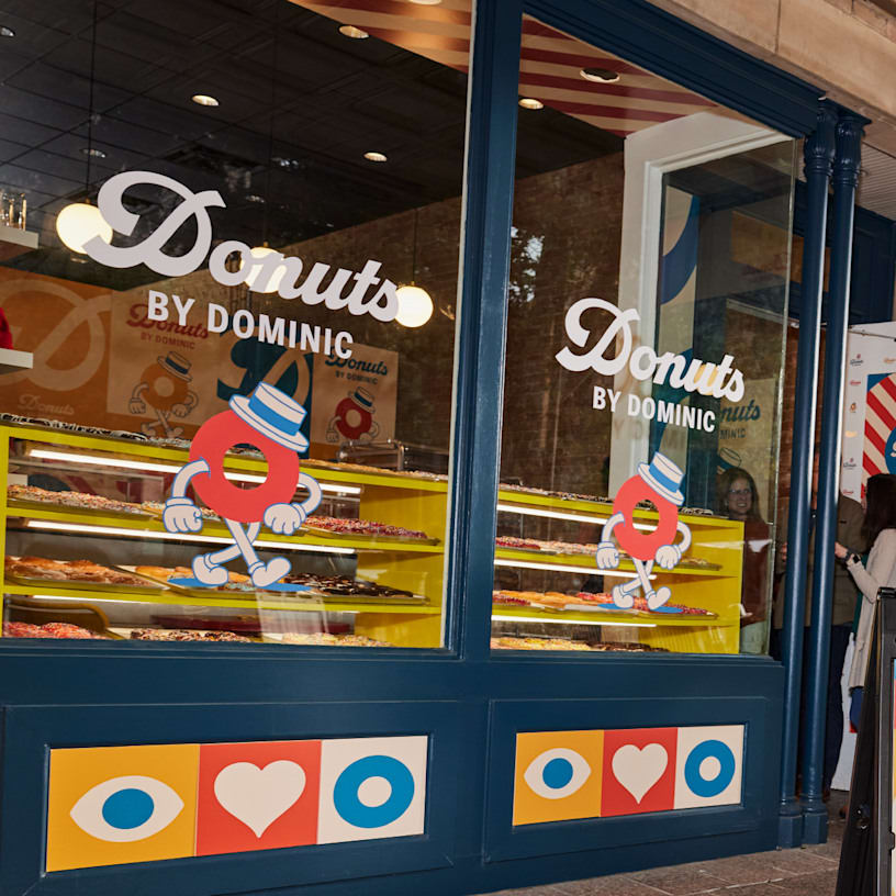 Branded clear stickers applied to the storefront glass