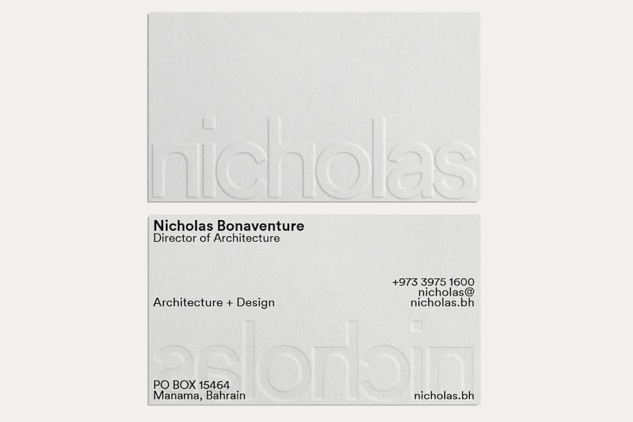 Minimal business card design in muted tones with subtle embossed details