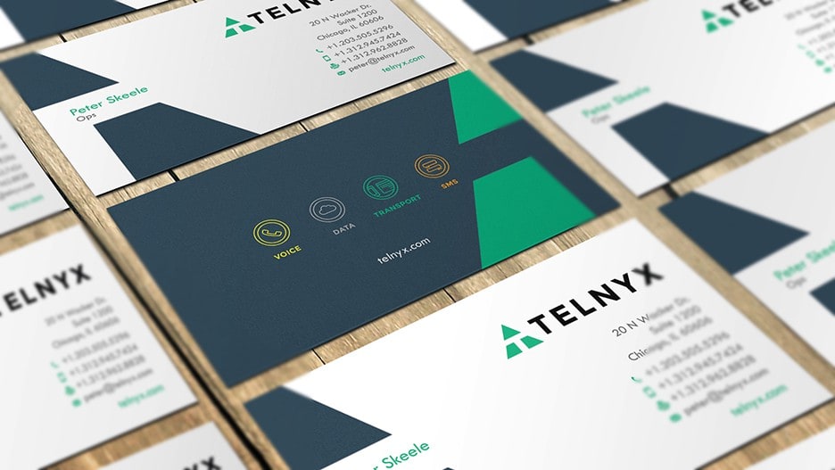 Business card design with a white background on the front and a navy background on the back of card, with green elements.