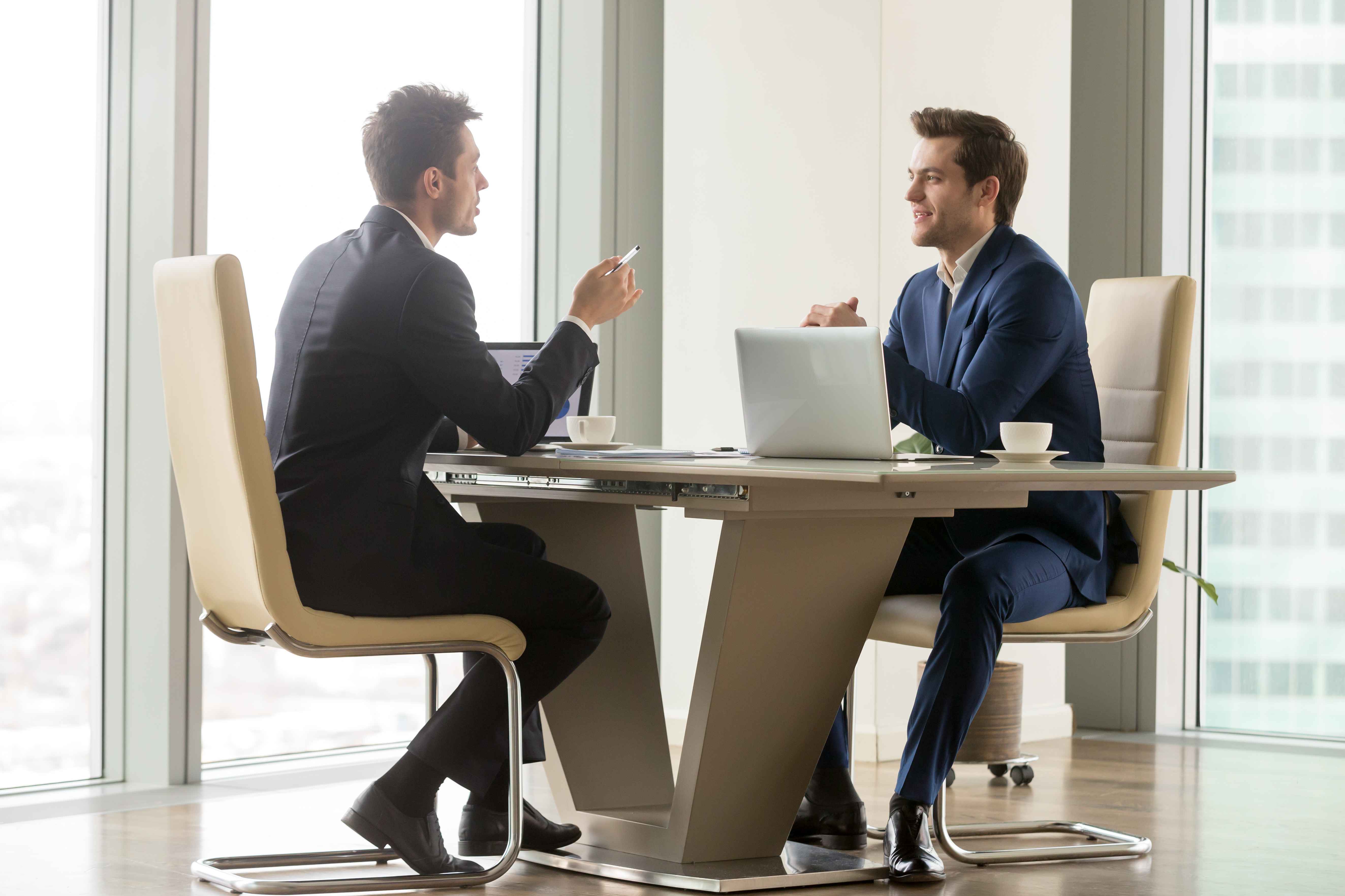 Two advisors sitting and making a plan — Wealth Consulting
