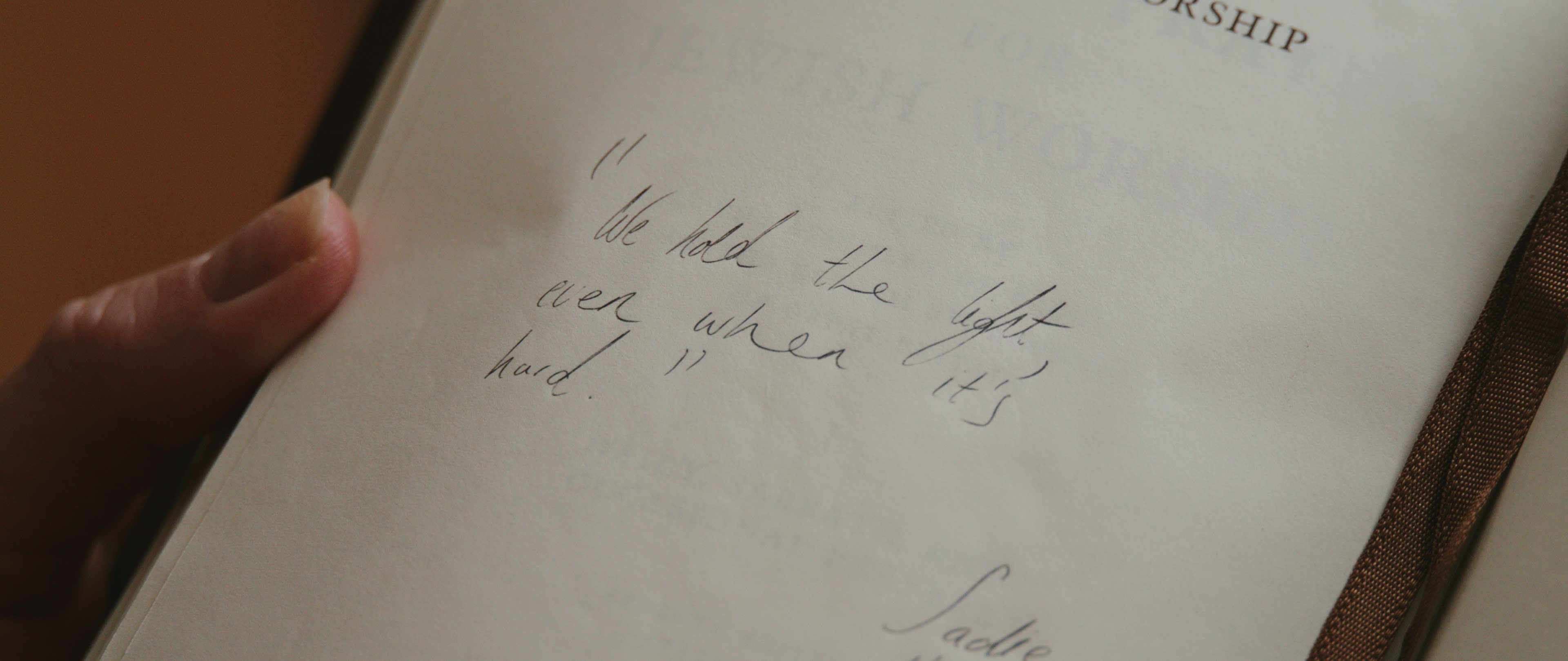 A handwritten family note in a still from Inheritance
