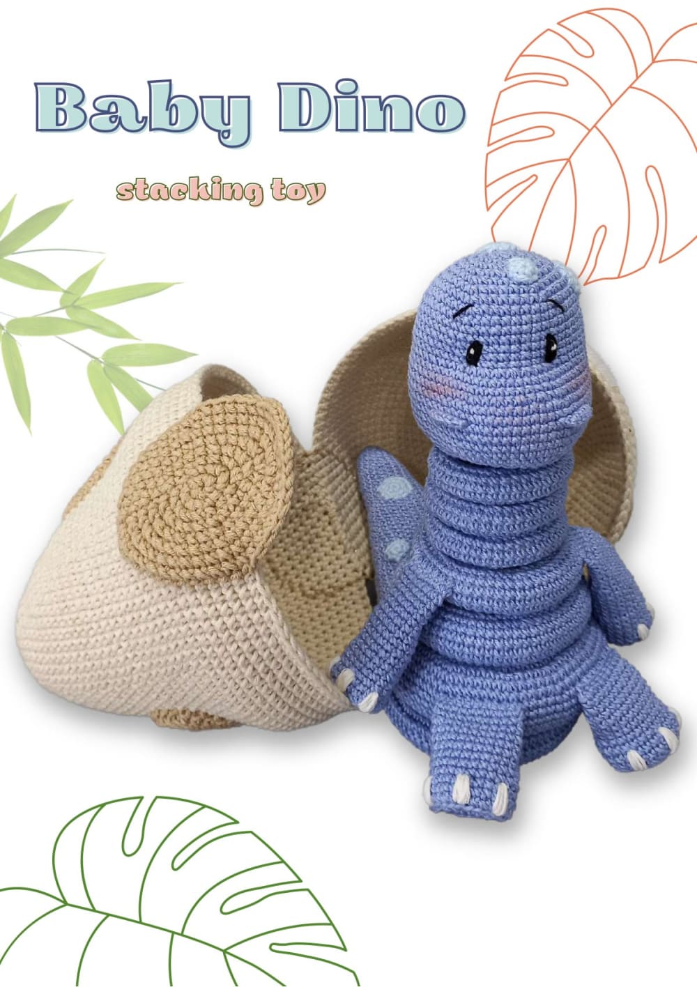Blue crochet baby dinosaur stacking toy with rings sitting in front of a cream crochet egg