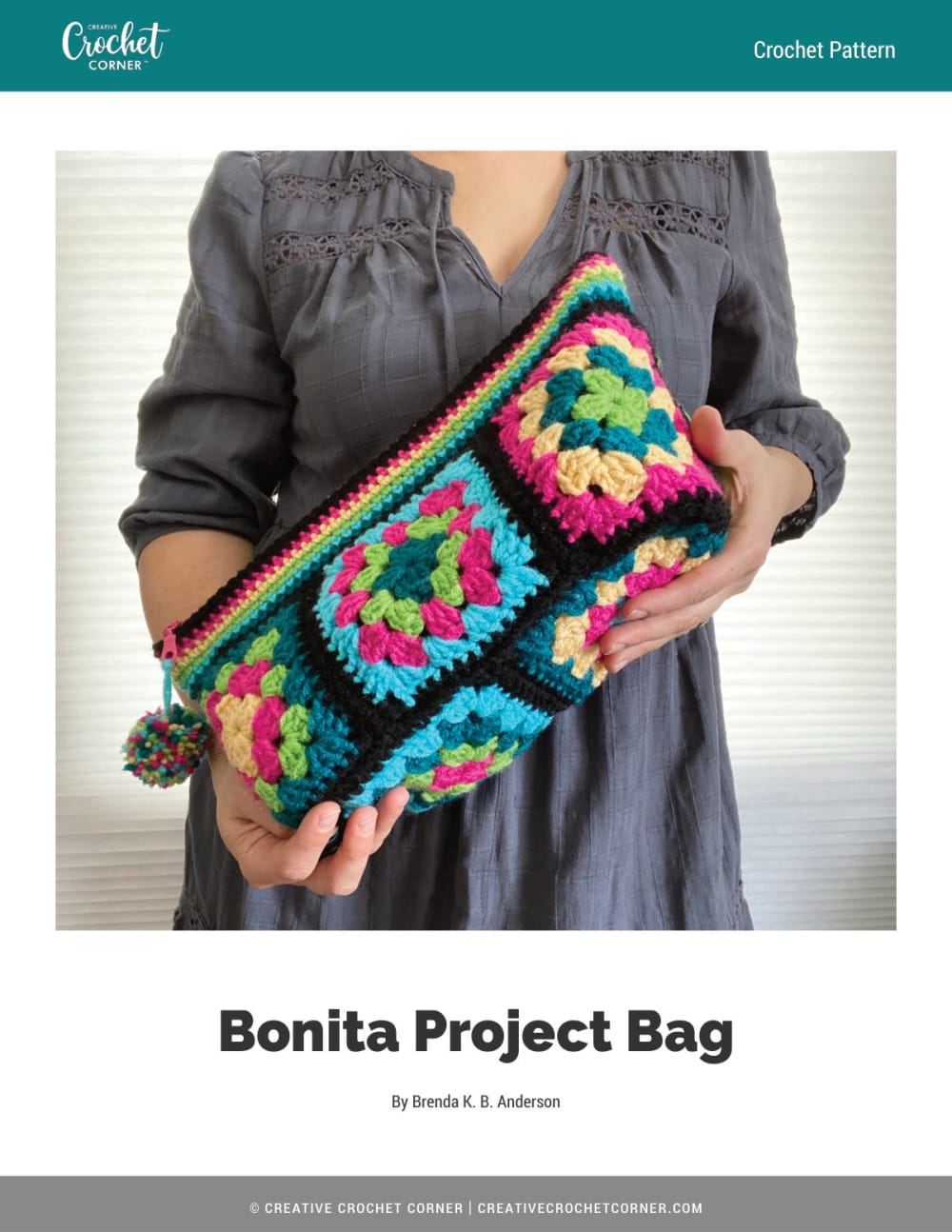 Woman holding a colorful granny square zippered crochet project bag with a black border