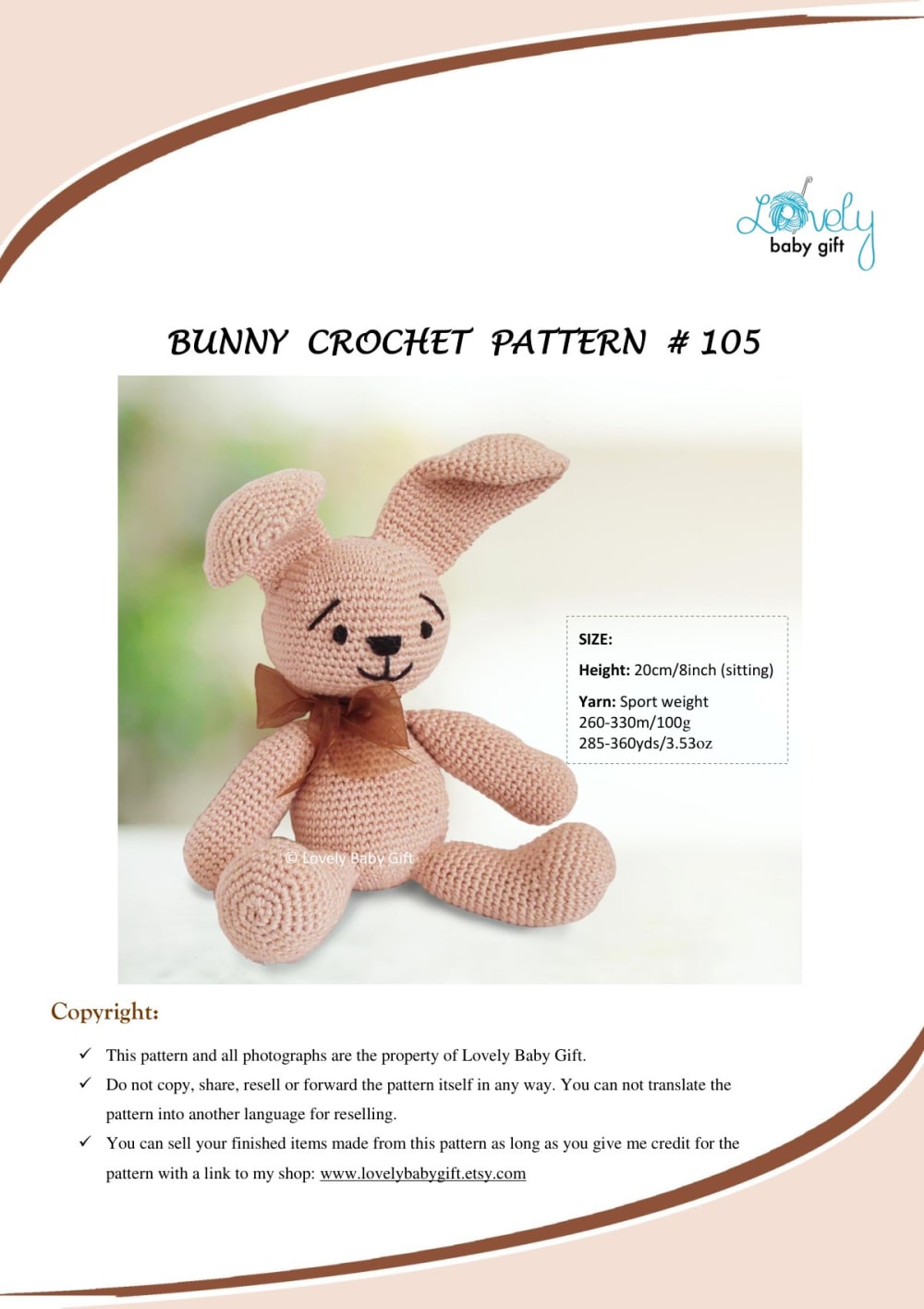 Pink-beige crochet bunny with long ears and a brown bow sitting upright