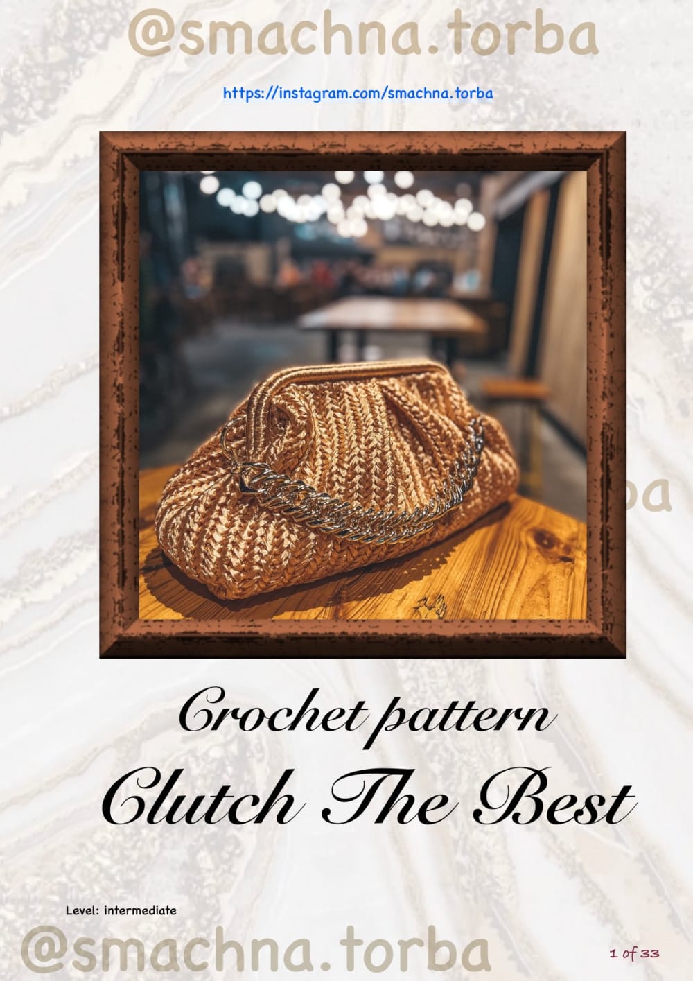 Bronze raffia crochet clutch bag with a metal chain on a wooden table