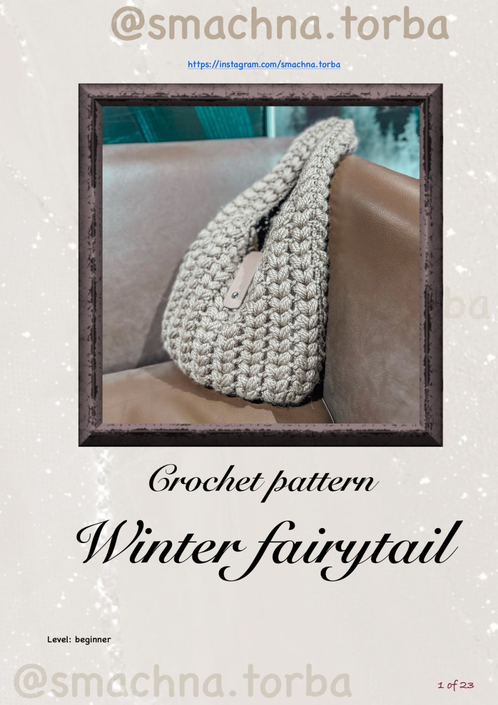 Taupe puff stitch crochet hobo bag with a curved handle on a leather sofa