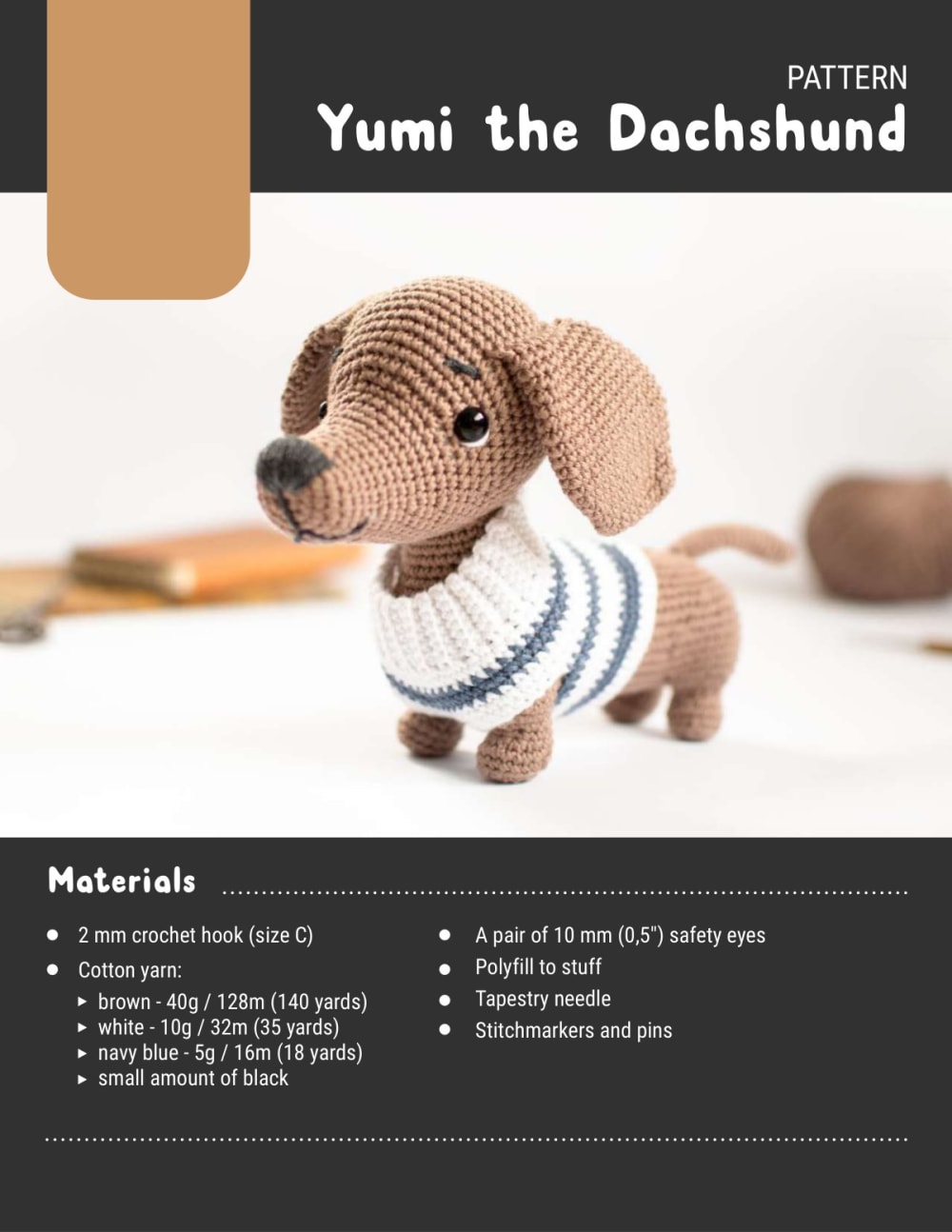 Brown crochet dachshund wearing a white sweater with blue stripes, shown on a white background
