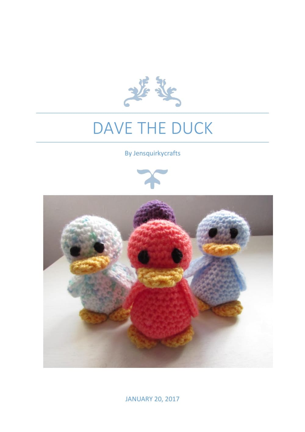 Group of small crochet ducks in pastel, red, purple and orange with orange feet and beaks