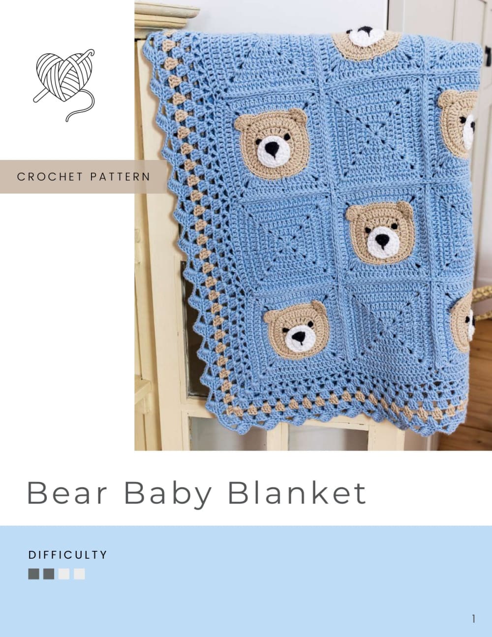 Blue baby blanket with beige teddy bear face squares and a white scalloped border