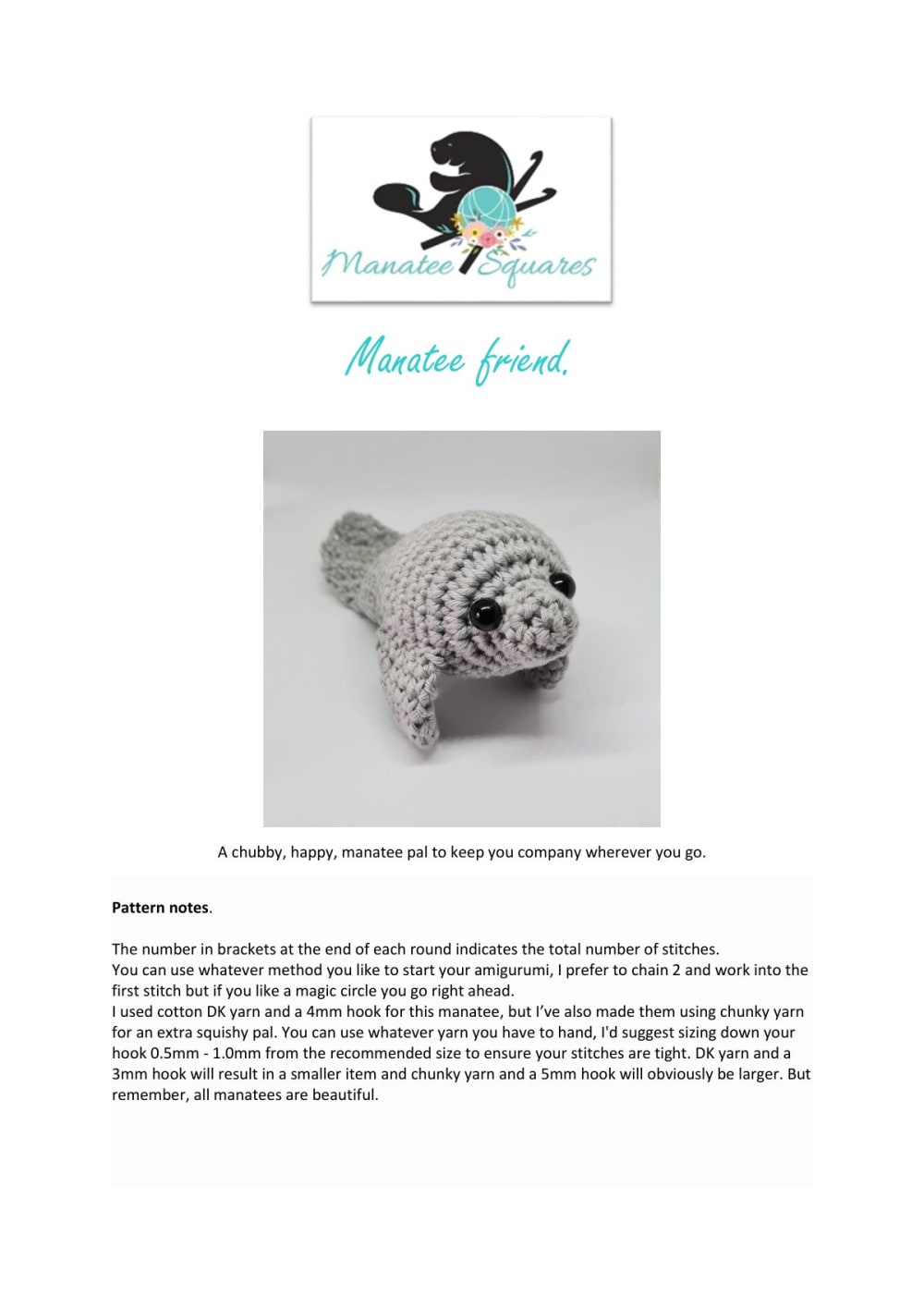 Grey crochet manatee amigurumi with safety eyes on the cover