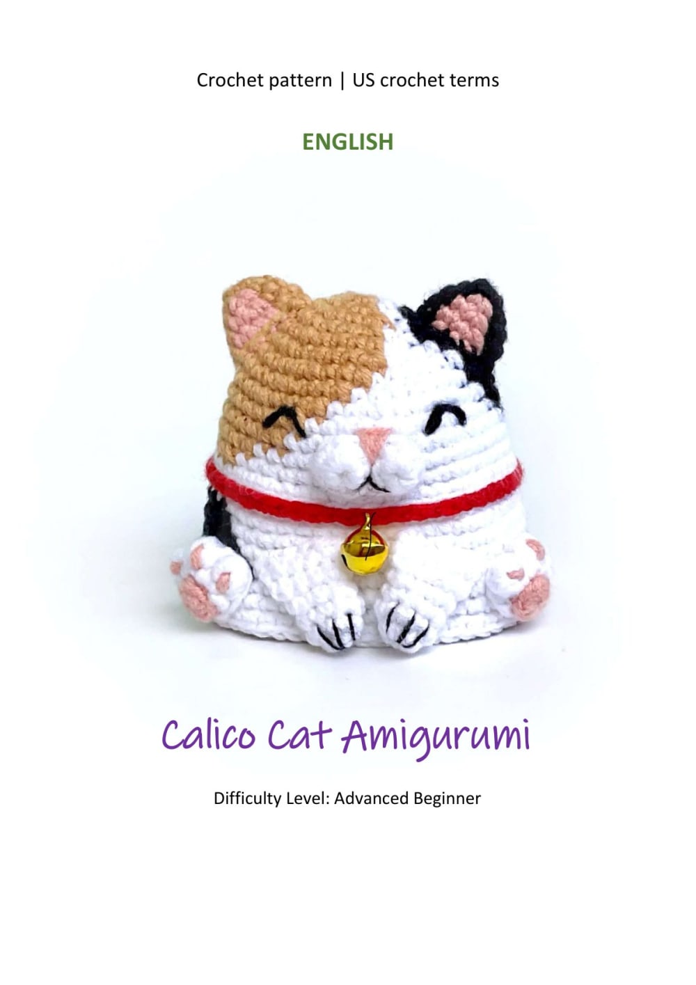 Calico cat amigurumi with a red collar and a golden bell