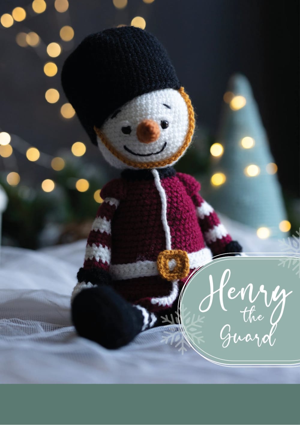 Henry the snowman guard in a red jacket and a tall black hat