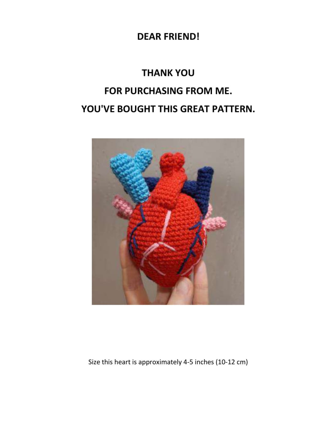 Crochet anatomical heart in red with blue and pink vessels