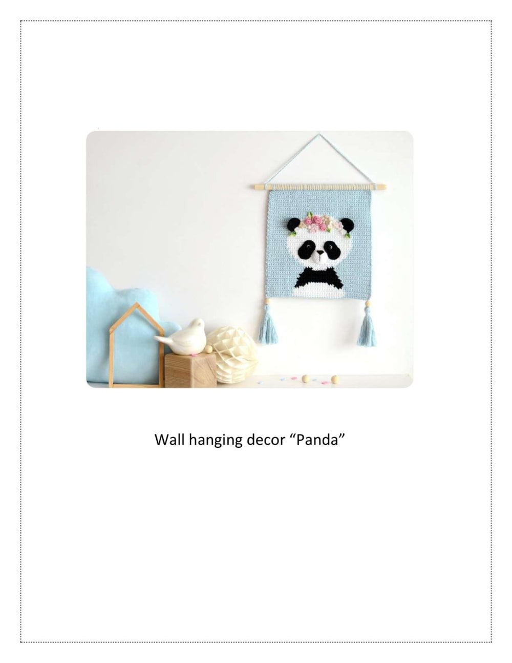 Blue crochet wall hanging with a panda wearing a bow tie