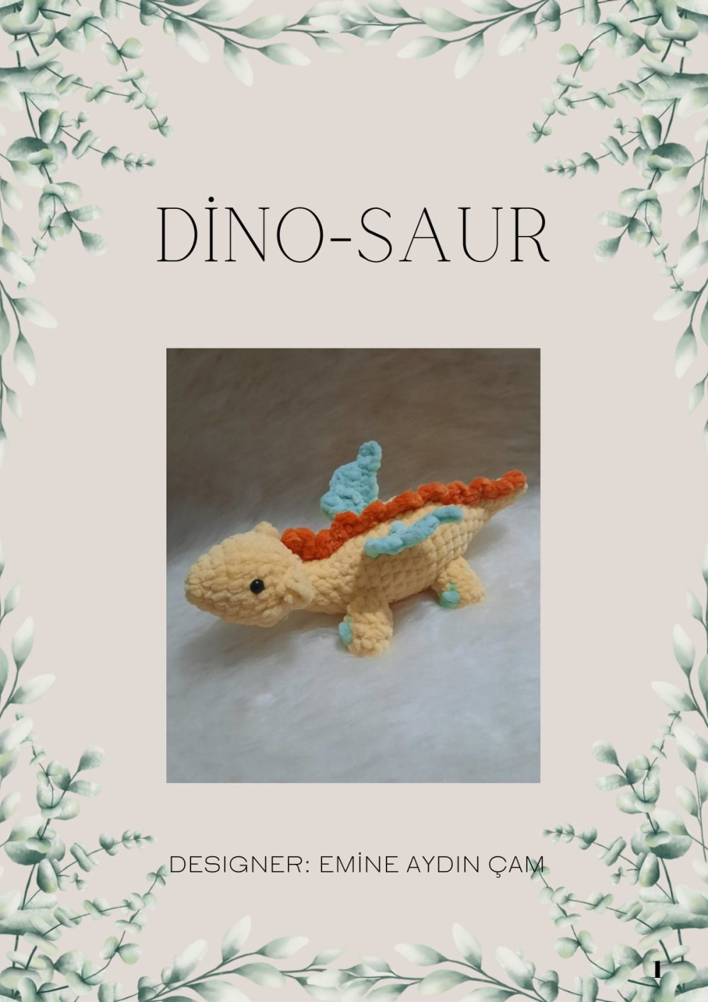 Yellow crochet dinosaur with orange spikes and mint wings